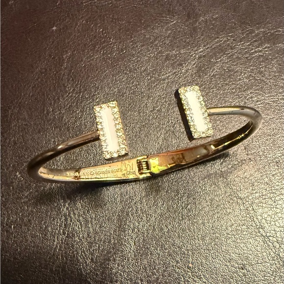 Kate Spade New York White Enamel
Hinged Cuff Bracelet. - Picture 2 of 9